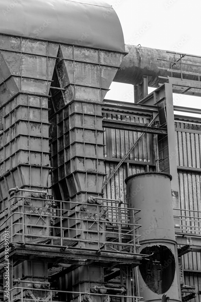 old metal parts of a blast furnace of the coking plant in a disused industrial area