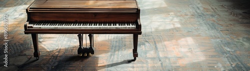 Elegant grand piano in a spacious rustic room, sunlight streaming through windows, highlighting its polished wooden surface and intricate keys. photo