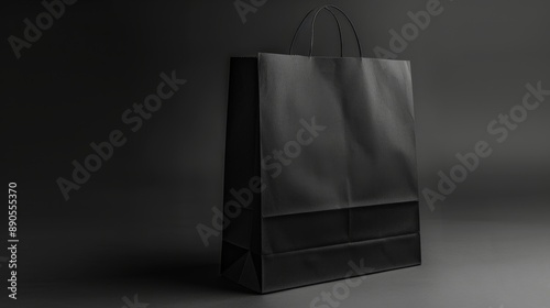 Black Paper Shopping Bag on Gray Background.