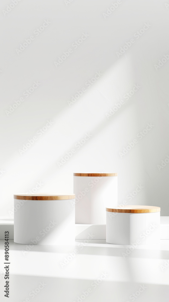 Sunlight casting shadows on three white podiums with bamboo lids Sunlight casting shadows on three white podiums with bamboo lids