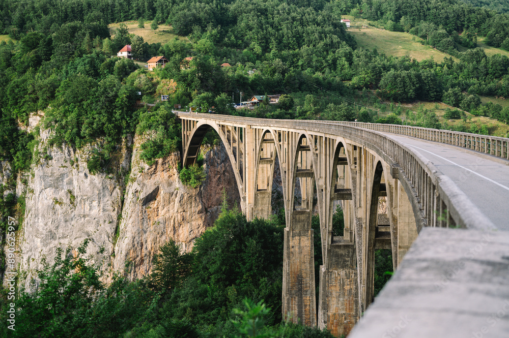Tara Bridge and Canyon, Tepca, Durmitor National Park, Montenegro - golden bridge over forest and rocks Tara Bridge and Canyon, Tepca, Durmitor National Park, Montenegro - golden bridge over forest and rocks