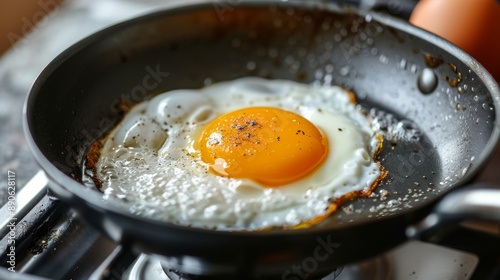 1-shot fried egg on a frying pan