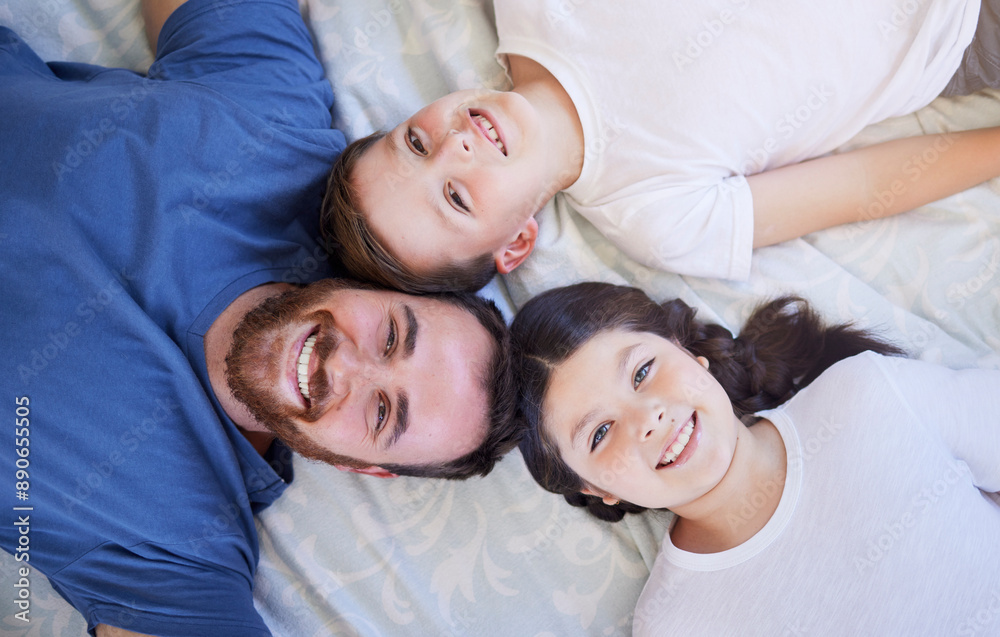 Happy family, portrait and relax with bed above for bonding, holiday or weekend together at home. Top view of father with children, son or daughter for morning, wake up or lying in bedroom at house Happy family, portrait and relax with bed above for bonding, holiday or weekend together at home. Top view of father with children, son or daughter for morning, wake up or lying in bedroom at house