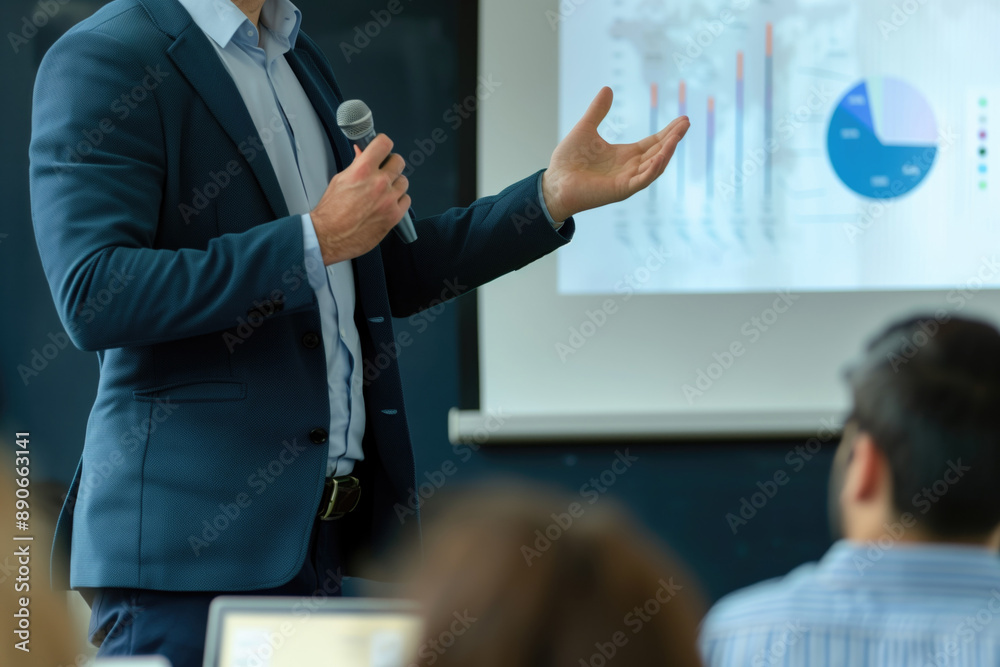 © Anna - Business professional giving a presentation with charts and graphs on projector in a meeting. Business communication, public speaking, data analysis, corporate meeting, office work.
