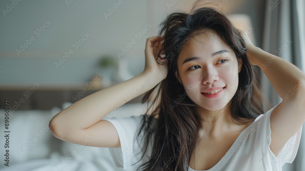 Smiling Woman with Long Dark Hair Running Her Fingers Through Her Hair Smiling Woman with Long Dark Hair Running Her Fingers Through Her Hair
