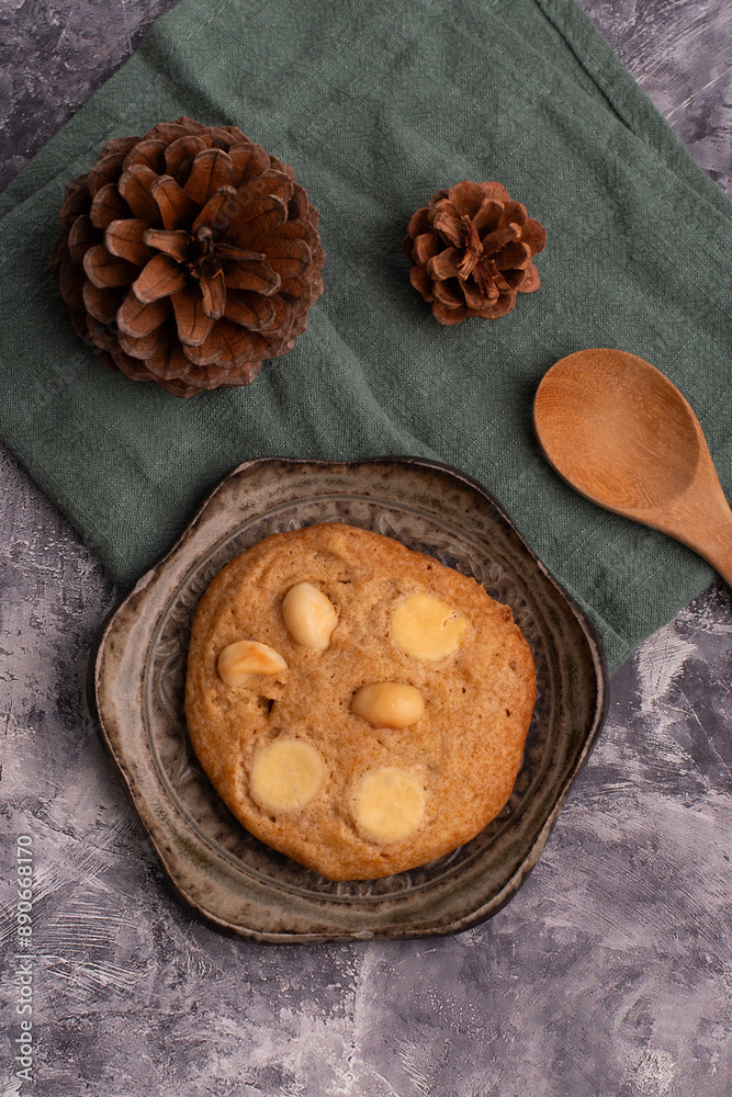 chocolate macadamia soft cookies on a table and plate