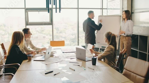 During a productive business meeting in a modern office setting, collaboration and innovation were fostered among skilled team members, promoting teamwork in a corporate environment