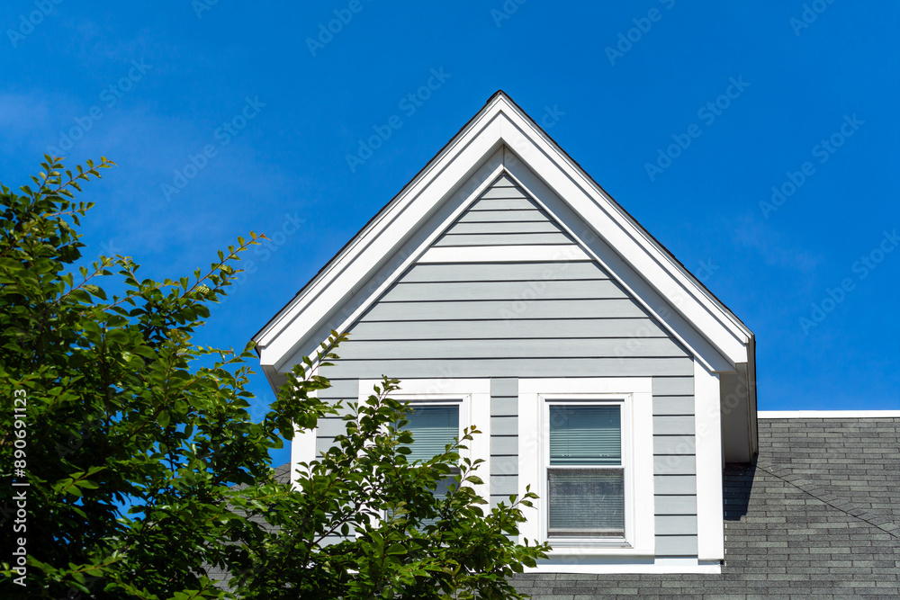Close-Up View of a Gabled Dormer Window on the Sloped Roof of a Newly Built House, Brighton, Massachusetts, USA Close-Up View of a Gabled Dormer Window on the Sloped Roof of a Newly Built House, Brighton, Massachusetts, USA