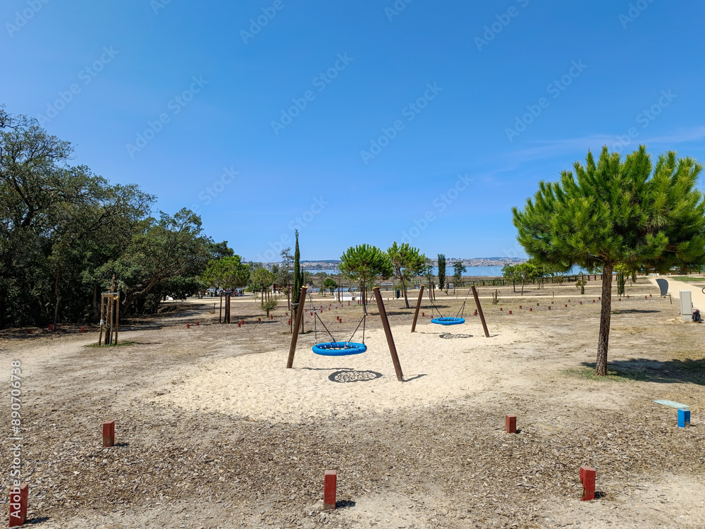 Seixal urban park with recreation equipment for children and Tagus River and Lisbon in the background, PORTUGAL Seixal urban park with recreation equipment for children and Tagus River and Lisbon in the background, PORTUGAL