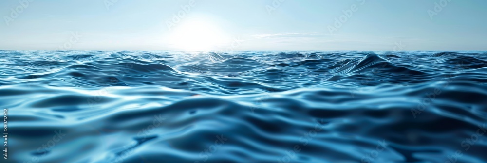 Naklejka premium Stunning view of deep blue ocean waves shimmering under the bright sun, evoking peace and tranquility.