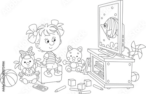 Happy little girl among her scattered toys watching TV with an animated cartoon film about a funny butterfly fish swimming on a  tropical coral reef, black and white vector illustration