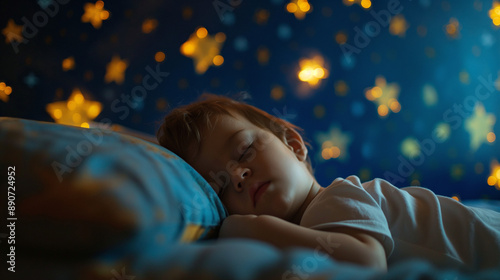 Obraz na płótnie Side view of a beautiful and cute male toddler baby kid sleeping and resting at night in a dark room with blue and yellow glowing stars on the walls. Little newborn child sweet dreams, infant bedroom w salonie
