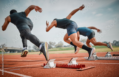 Fototapeta Naklejka Na Ścianę i Meble -  Race, start and group of men running at arena for speed challenge, marathon event and professional sports. Action, go and people at stadium for track competition, fitness and fast athlete from back