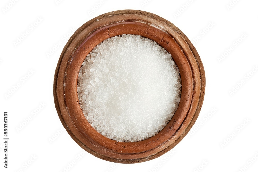 A bowl filled with white sugar sitting on a table, perfect for baking or decoration A bowl filled with white sugar sitting on a table, perfect for baking or decoration
