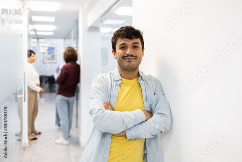 Smiling man and colleagues in modern English academy photo