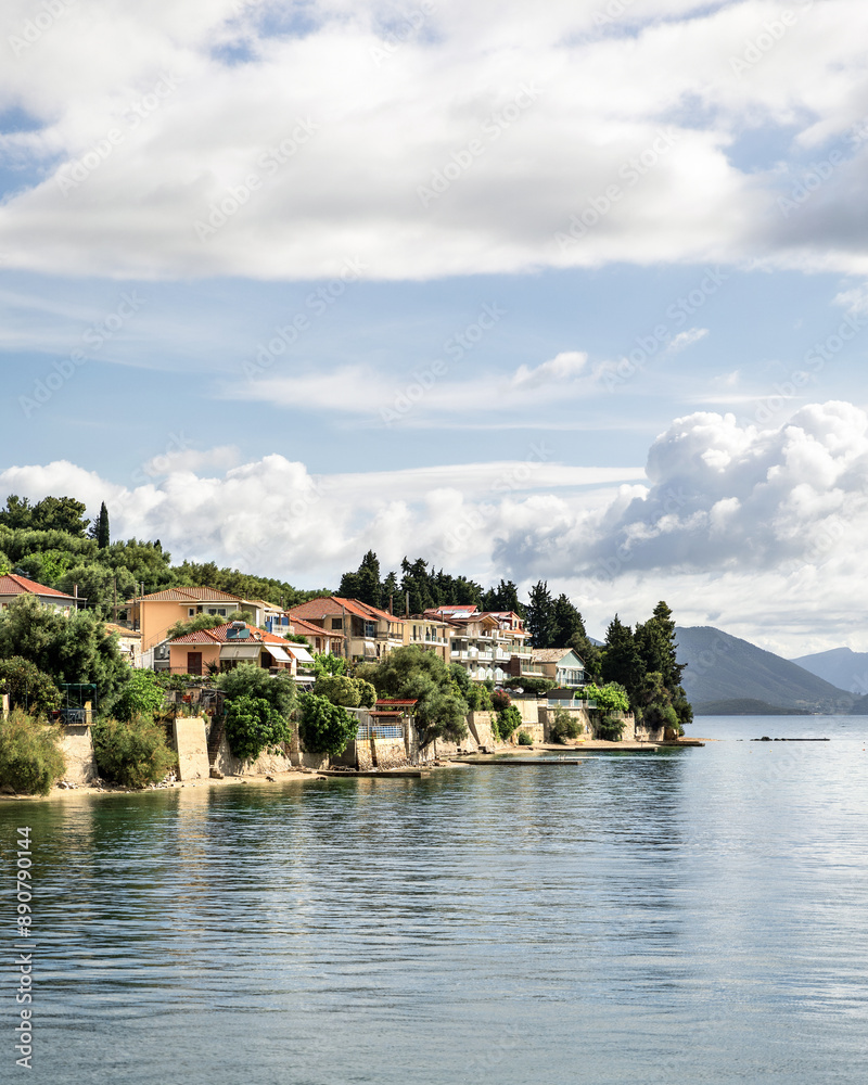 Fototapeta premium Cruise from Nidri port in Lefkada or Lefkas Greek island, Ionian Sea near Preveza. Summer vacation on boat, cloudy sky