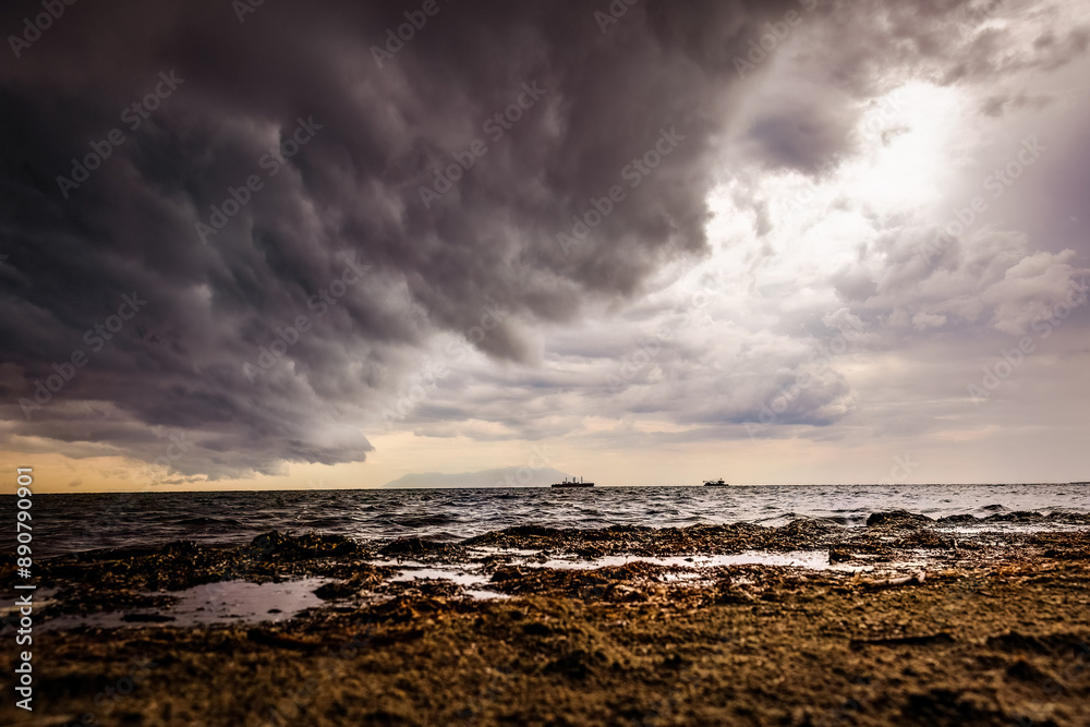 Romantic sunset on the beach with cloudy sky like a painting, view to Samothrace island Romantic sunset on the beach with cloudy sky like a painting, view to Samothrace island