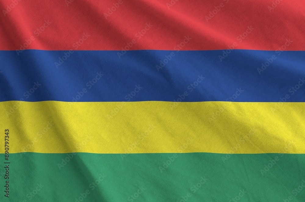 Fototapeta premium Mauritius flag depicted on folded wavy fabric of old cloth close up