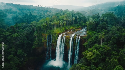 Gorgeous waterfall surrounded by verdant tropical vegetation in Sri Lanka.