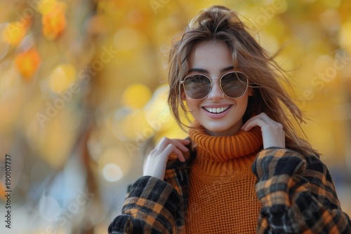 Smiling Woman in Plaid Jacket With Autumn Leaves in Background