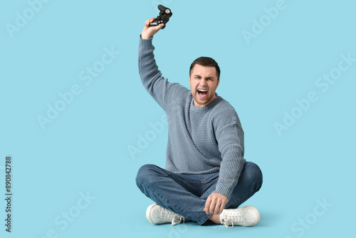 Angry young man with game p...