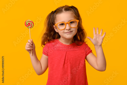 Cute little girl with lolli...