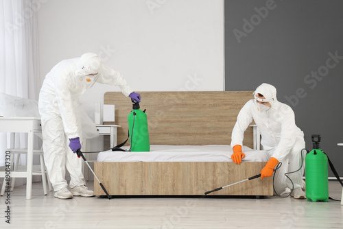Male workers disinfecting f...