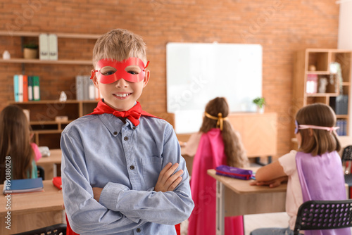Teenage boy dressed as supe...