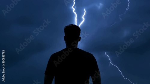 Storm's Embrace: Man Silhouetted Against Lightning