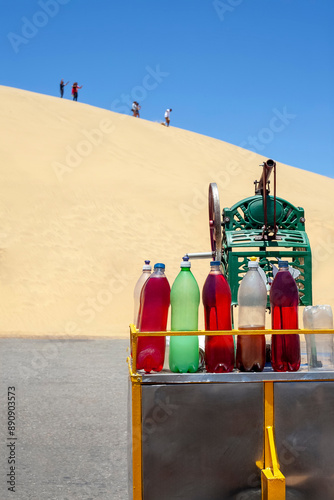 Medanos de Coro, Falcon, Venezuela. Colorful Bottles of Refreshments in Front of Desert Dunes photo