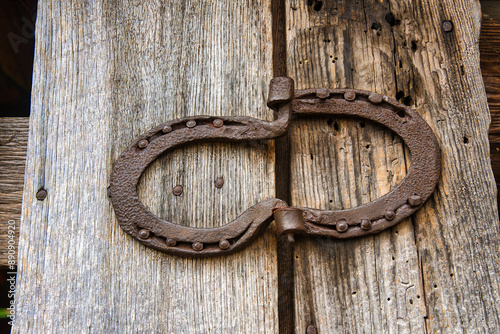 horseshoe hinge on wooden door