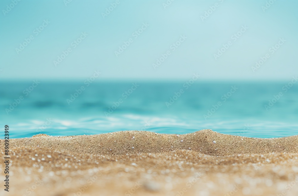 Close-up of golden sandy beach with turquoise waves in the background, evoking a tranquil coastal atmosphere. Close-up of golden sandy beach with turquoise waves in the background, evoking a tranquil coastal atmosphere.