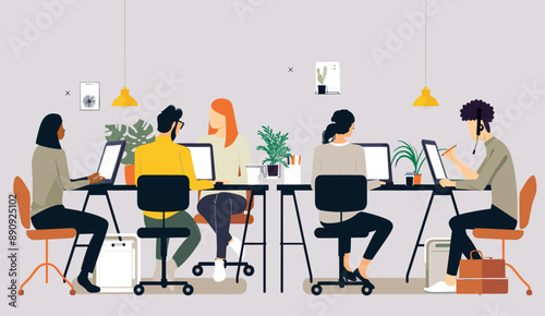 Diverse group of professionals working together in an open office environment. Co-working concept