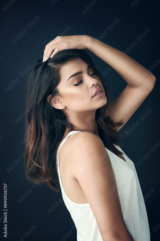 Confident, woman and thinking with hair care in studio for shampoo treatment, shine and pride. Serious, female person and face with satisfaction for salon results, growth and glow on black background Confident, woman and thinking with hair care in studio for shampoo treatment, shine and pride. Serious, female person and face with satisfaction for salon results, growth and glow on black background
