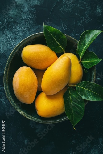 Fresh Arumanis Mango in a bowl, Top View photo