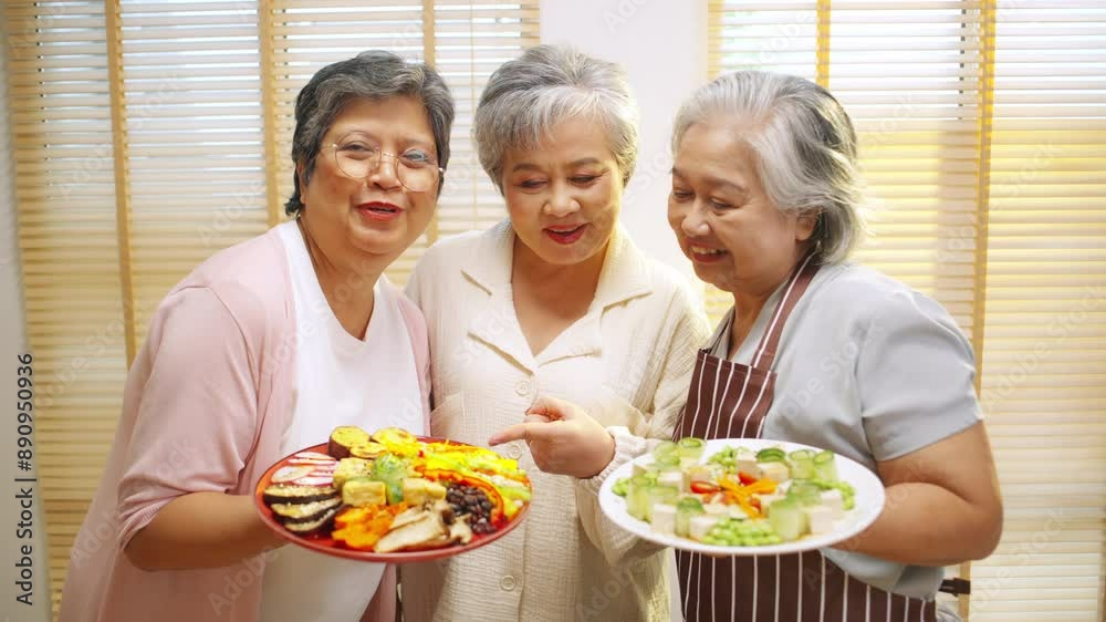 Portrait Group of Happy Asian senior women having dinner together at home. Elderly woman friends enjoy healthy lifestyle cooking and making vegan food vegetable salad with tofu together in the kitchen Portrait Group of Happy Asian senior women having dinner together at home. Elderly woman friends enjoy healthy lifestyle cooking and making vegan food vegetable salad with tofu together in the kitchen