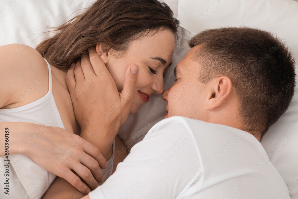 Lovely couple spending time together in bed Lovely couple spending time together in bed