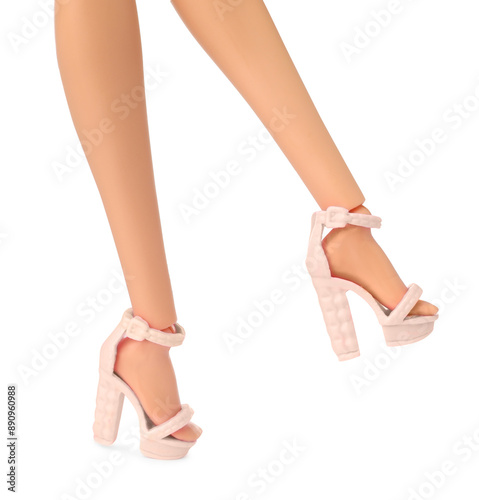 Doll's legs with fancy shoes on white background