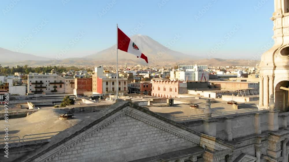 aerial view of the national flag of peru with the misti volcano and the cathedral of Arequipa