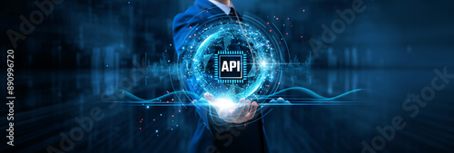 API integration, businessman holds digital interface on global structure network and data interoperability, seamless communication, enhanced user experience. photo