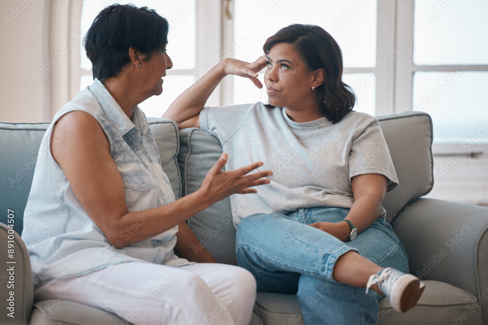 Mother, daughter and sofa or argument with conversation for advice, support with lecture for problem. Mom, woman and together in home with communication for mistake, frustrated or angry for fail