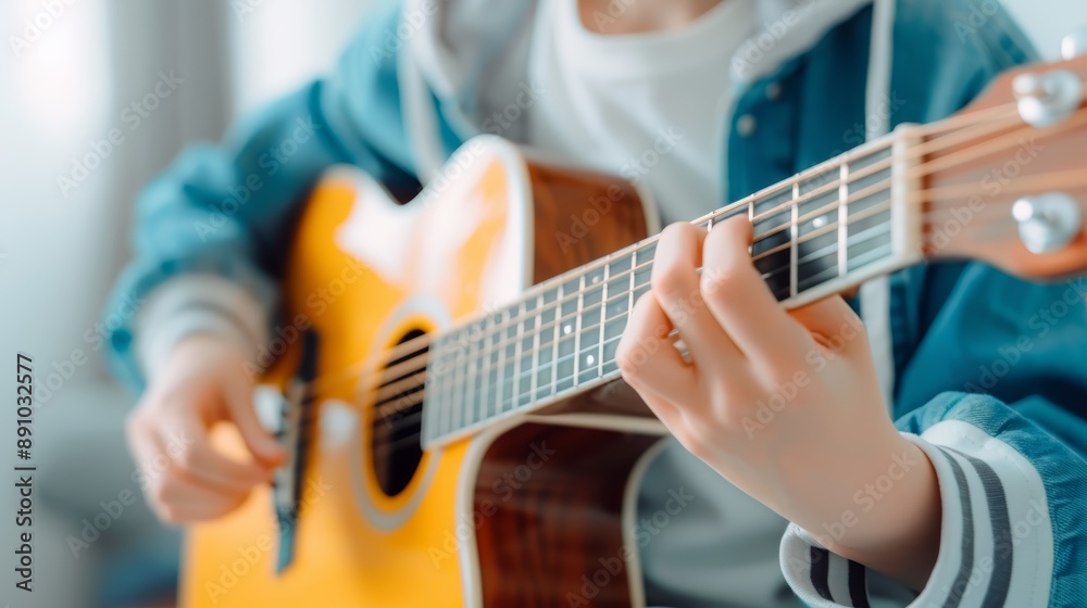 Fototapeta premium Close-up of Person Playing Acoustic Guitar