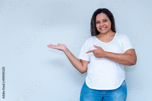 young man points with his hands to the right side, a space for your product or message, person, advertising concept, mockup space photo