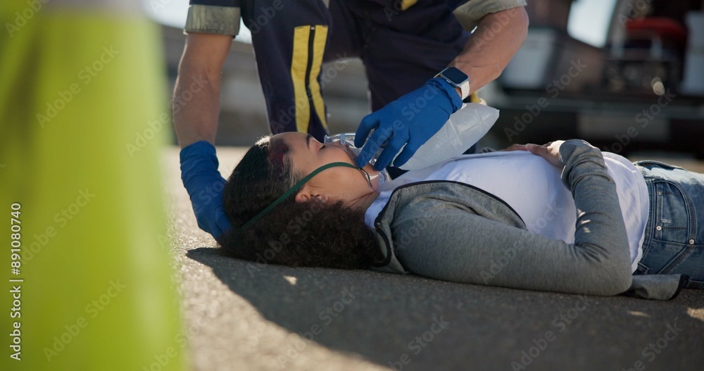 Woman, accident and emergency on road with oxygen for life support, medical or trauma with ventilation. Paramedic, first aid or health insurance or air mask for breath on street, ems or crisis Woman, accident and emergency on road with oxygen for life support, medical or trauma with ventilation. Paramedic, first aid or health insurance or air mask for breath on street, ems or crisis