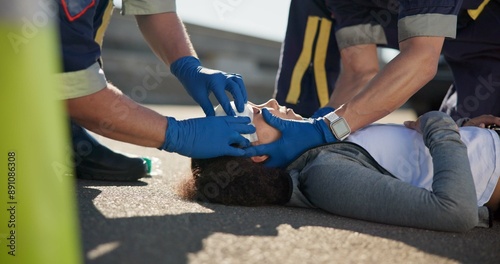 Photos Paramedic, accident and hands on head injury on road in car crash emergency with healthcare people