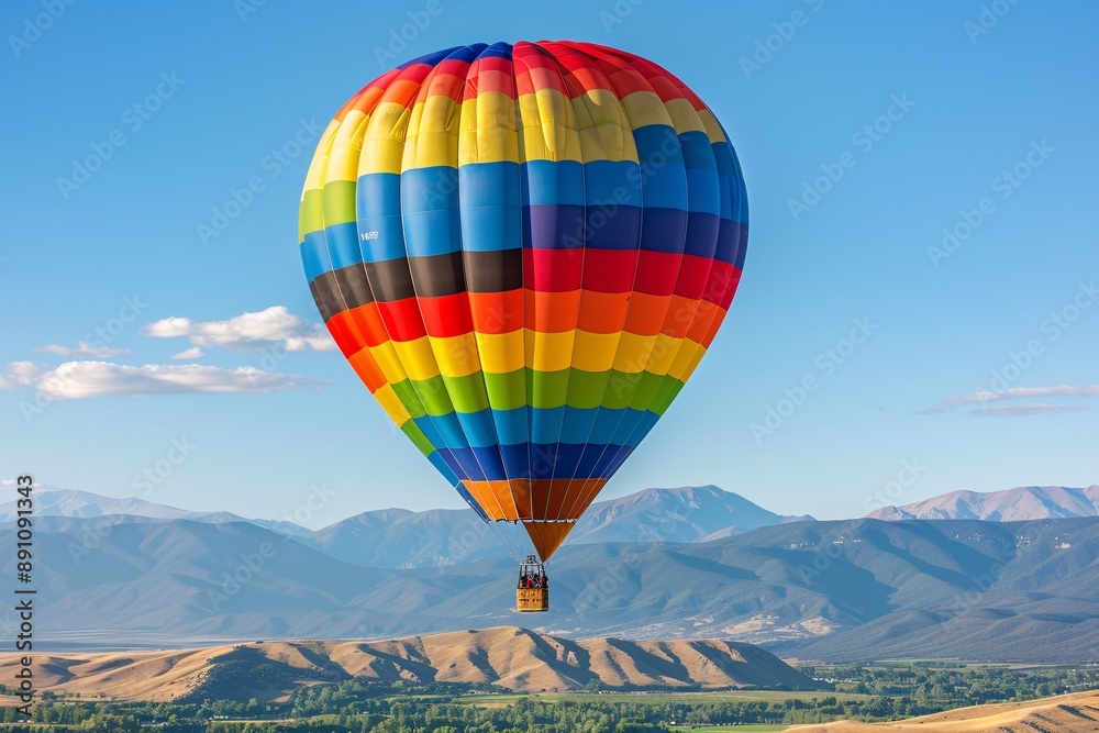 Naklejka premium A_colorful_hot_air_balloon_floating_in_a_clear_blue