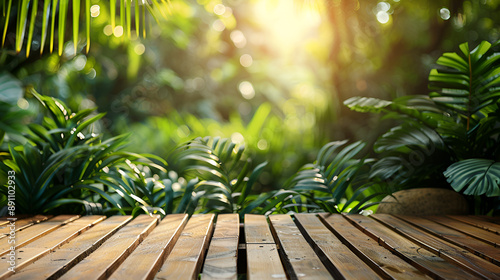 Wood podium table top outdoors blur green monstera tropical forest plant nature background.Beauty cosmetic healthy natural product placement pedestal display,spring or summer jungle parad