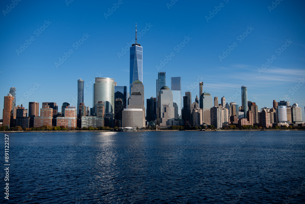 Fototapeta premium New York, United States. New York city skyline in Midtown Manhattan. USA, NYC, NY, Manhattan. American big city. Lower Manhattan skyline. New York from New Jersey. Downtown Manhattan with blue sky.