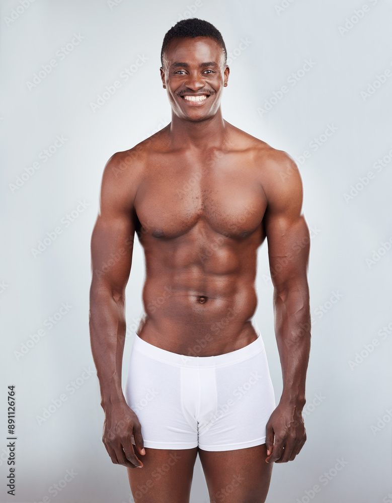 Fototapeta premium Black man, muscle and underwear portrait in studio with wellness, fitness and progress for workout. African bodybuilder, body skin and abs for exercise, sport training and health by white background