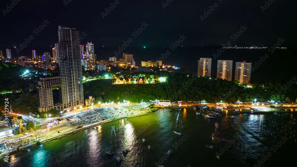 Naklejka premium aerial of Pattaya Thailand sign city illuminated at night with skyline cityscape 
